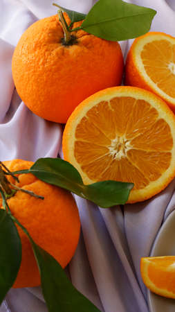 bright and juicy sliced oranges on the tableの写真素材