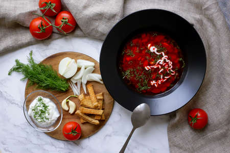 Russian traditional dish borscht and onion with breadの写真素材