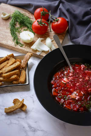Russian traditional dish borscht and onion with breadの写真素材