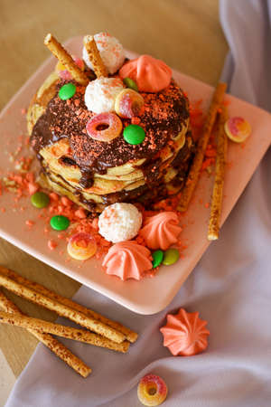 Homemade delicious pancakes with chocolate and sweetsの写真素材