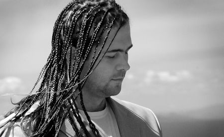 Young man with stylish hairdo - dreadsの写真素材