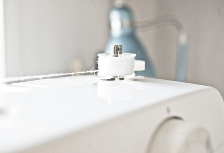 sewing machine, winding thread on the bobbin, bobbin closeup