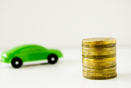 car and coins, buying a car, money for carsの写真素材