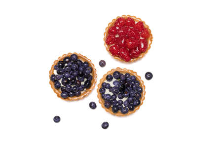 Delicious fresh dessert tartlet of shortbread decorated with fresh blueberries and Raspberry. The...