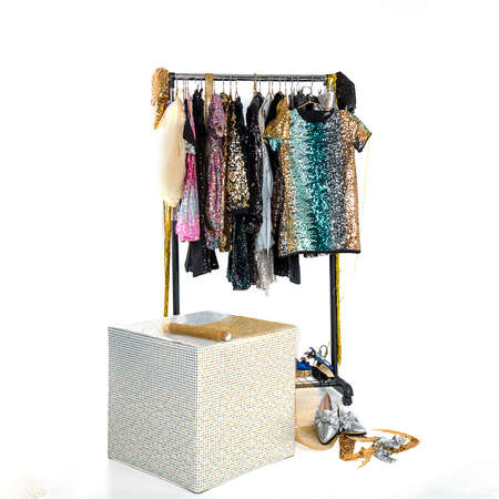 Rack coat hanger with smart beautiful women's holiday dresses, shoes in rhinestones, sequins....