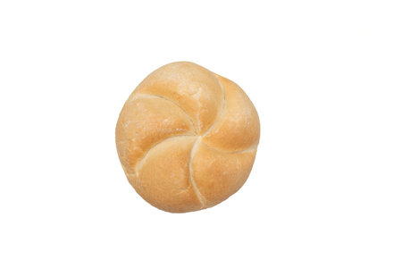 Appetizing fresh bavarian bun isolated on white background. Traditional Bavarian bread. Close-up studio photoの写真素材