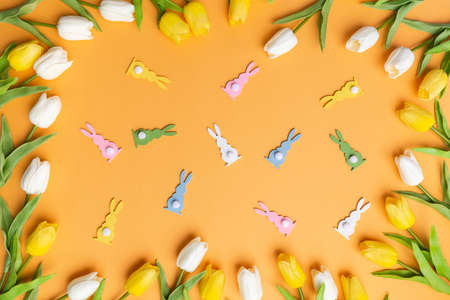 Overhead view happy easter orange background spring concept traditional colorの写真素材