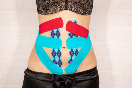 special physio tape put on injured abdomen white background weight loss concept