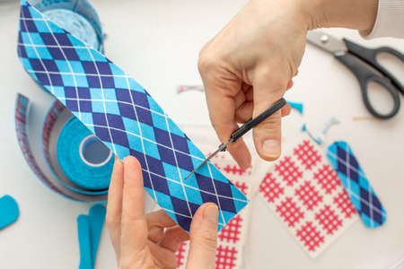 woman cut with scissors blue medical tape white background