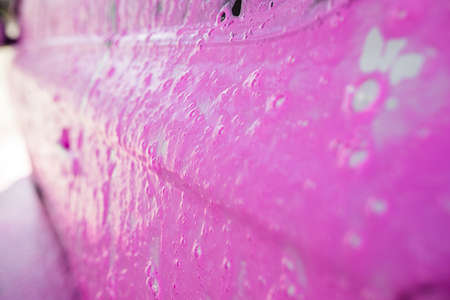 Cleaning, car wash, pink foam background stock photoの写真素材