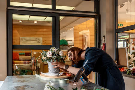 Organizer of weddings forms composition in flower box for decoration at celebration. Original decor conceptの写真素材