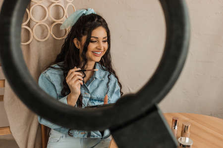 Young girl teaches makeup course for her subscribers. online education concept.の写真素材