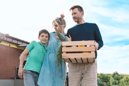 Parents and son carry home groceries from supermarket. Environmental packaging concept. High quality...