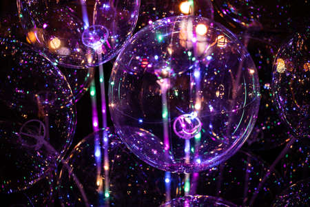 Purple sphere magic lights on black background photoの写真素材