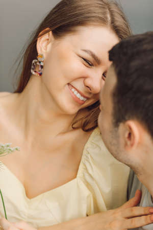Portrait of beautiful woman smiling happily at her man. Happiness and serenity. Beautiful moments of life. It's great time. Rright way of life. Happy relationship. Taking care of each other.の写真素材