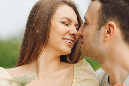 Beautiful couple expresses love and tenderness to each other in nature. Happiness and serenity....