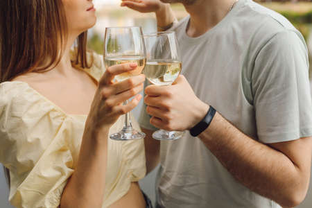 Pleasant moments of a couple's date with wine in glass glasses. Happiness and serenity. Rest and enjoyment.Wonderful moments of life. Super day. Romantic relationships.Lifestylesの写真素材