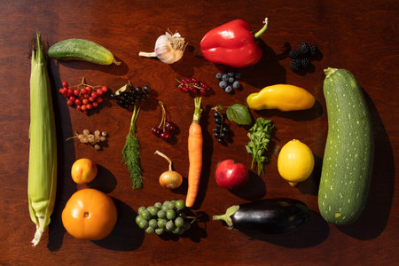 Knolling image of colorful vegetables on wooden carving board. Raw healthy culinary diet eco-food. Top view. Flat lay.の写真素材