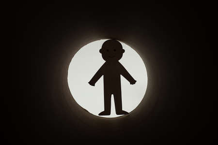 Photo of concept of resolving troubles in form of paper cut joyful man escaping from darkness in...
