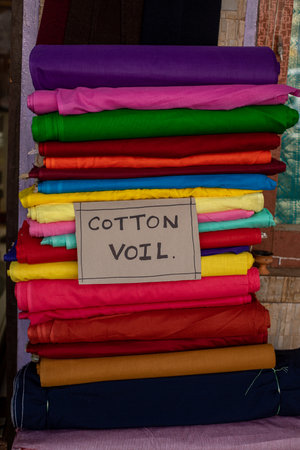 Cotton monophonic, multicolored fabrics are stacked. Modern natural dyes. Bright colors. Cotton, staple, satin, cambricの写真素材