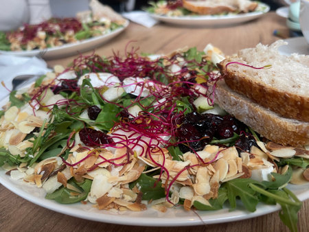 Exquisite salad with almonds, beetroot sprouts, pears and cheese, restaurants signature dish .の写真素材