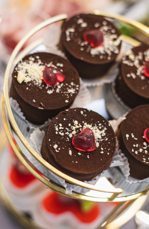 Delicious chocolate desserts on round tray at wedding, party, holiday. Candy bar .の写真素材