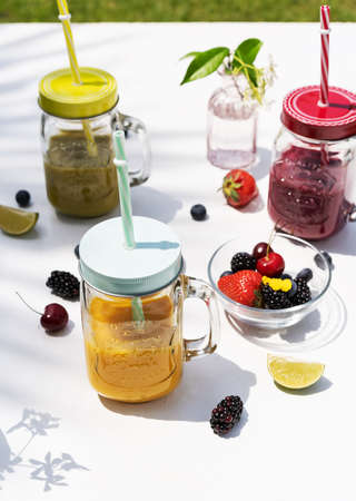 Smoothies in the garden in sunny dayの写真素材