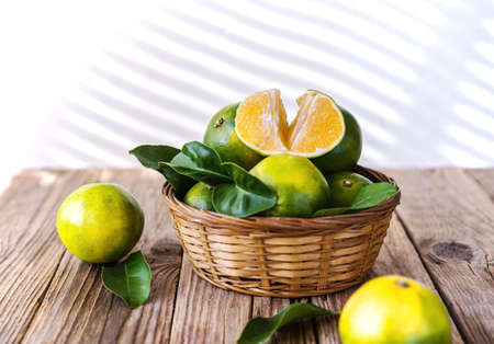 Mapo fruits in basket on the wooden tableの写真素材