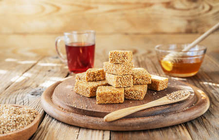 Eastern sweets - sesame mini-bars with main ingredients and fruit tea