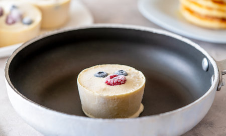 Frozen batter for pancakes are homemade preparation or trendy ice cube pancakes. Frozen batter cube...