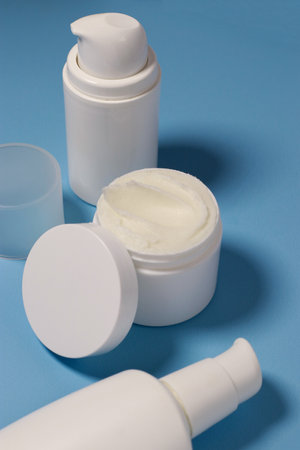 close up of mock up white jar with cream on a blue backgroundの写真素材