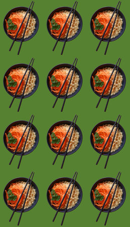 vegetarian ramen noodles with chopsticks pattern on green backgroundの写真素材