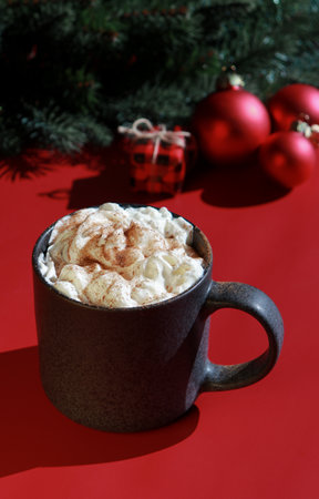 red Christmas background with hot chocolate and xmas decorationsの写真素材