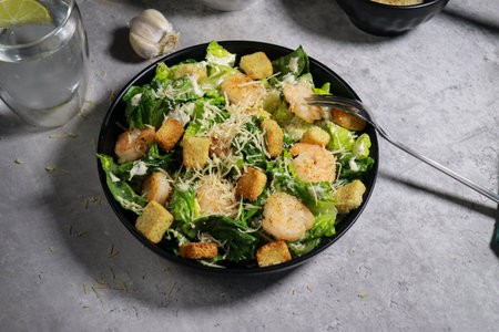 close up of Cesar salad with grilled shrimp, croutons and parmesan cheeseの写真素材