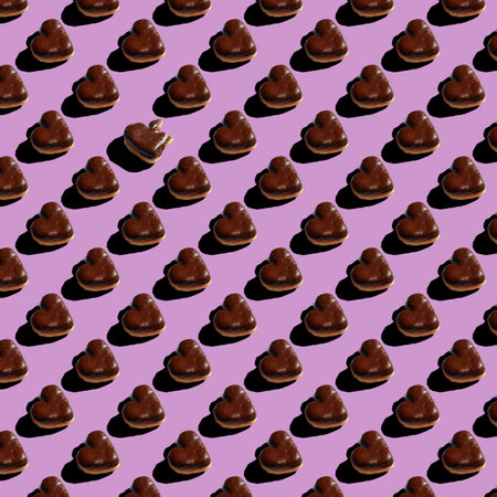 seamless pattern of chocolate heart shaped donuts on purple backgroundの写真素材
