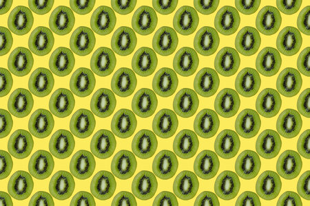 seamless kiwi fruit pattern on yellow backgroundの写真素材