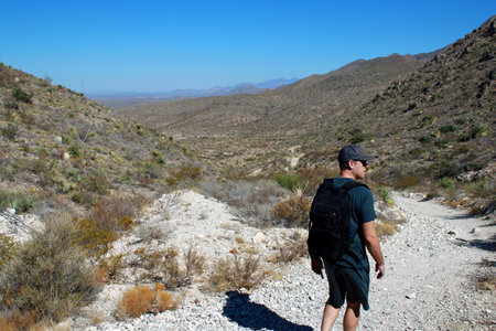man hiking with backpack in the mountains of Texasの写真素材