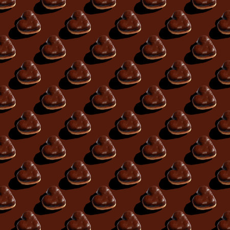 seamless pattern of chocolate heart shaped donuts on brown backgroundの写真素材