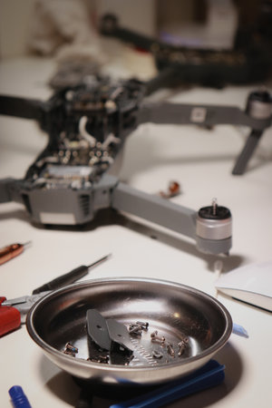close up of different repairing tools and a drone, on white tableの写真素材