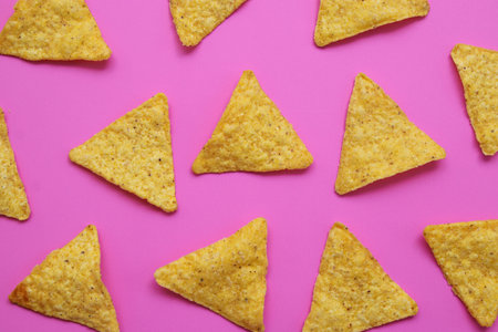 Tortilla chips isolated on bright pink background