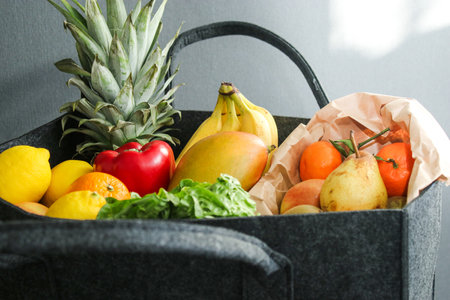 Close up of eco fruits and vegetables in a eco felt bagの写真素材