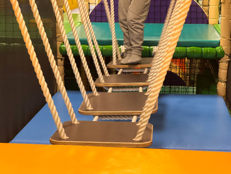 A toddler having fun at a colorful fun indoor playgroundの写真素材