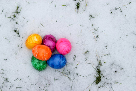 Colorful easter eggs in snowの写真素材