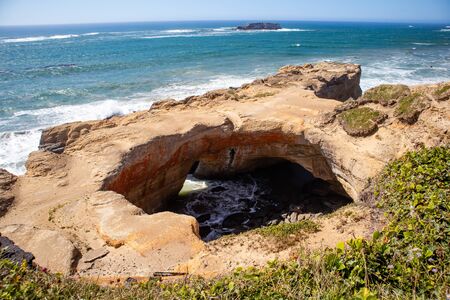 Devils Punchbowl State Natural Area, Otter Rock, Oregon in August at low tide, horizontalの写真素材