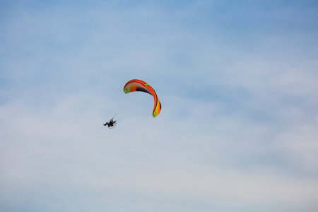 Marathon City, Wisconsin, USA, July 7, 2021: Taste N Glow Balloon Fest. Powered paraglider,...