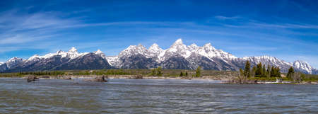 Grand Tetons from the Snake River in Grand Teton National Park, Wyoming, USA in the beginning of June, panoramaの写真素材