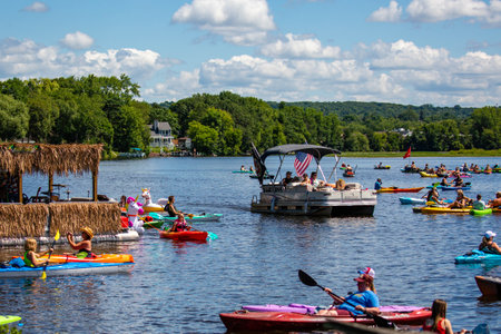 Wausau, Wisconsin, USA, July, 30, 2022: 8th Annual Paddle Pub Crawl on Lake Wausau and the Wisconsin River, Kayakers enjoy the Saturdays event with beautiful weather, horizontalのeditorial素材