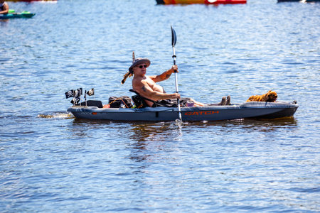 Wausau, Wisconsin, USA, July, 30, 2022: 8th Annual Paddle Pub Crawl on Lake Wausau and the Wisconsin River, Kayakers enjoy the Saturdays event with beautiful weather, horizontalのeditorial素材