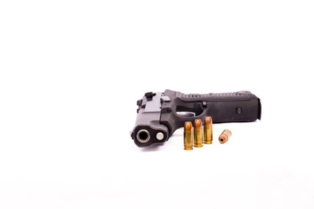 Gun, clip, hollow point bullets with copy space, horizontal