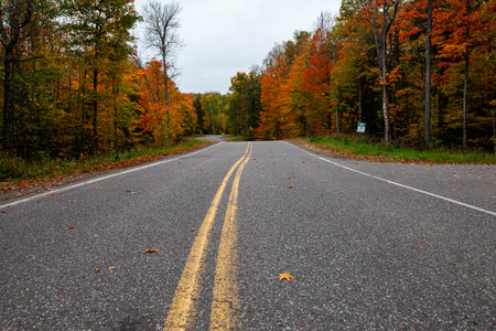 Lake of the Falls road in Mercer, Wisconsin in autumn, horizontalの写真素材